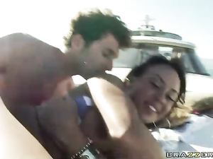Dark-haired chick with massive tits gets banged on a boat. She's wearing her bikini top (but not her bikini bottom), she gets fucked on a boat like a true whore.